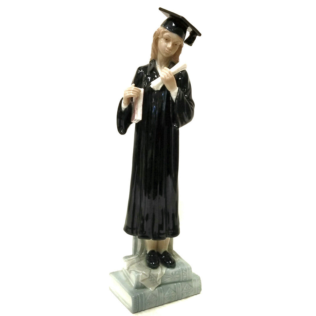Female Graduate Holding A Diploma And Book Standing On Books Figurine