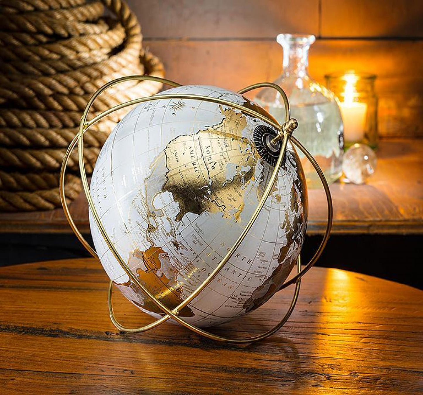 White And Gold Globe In A Wire Stand Globe