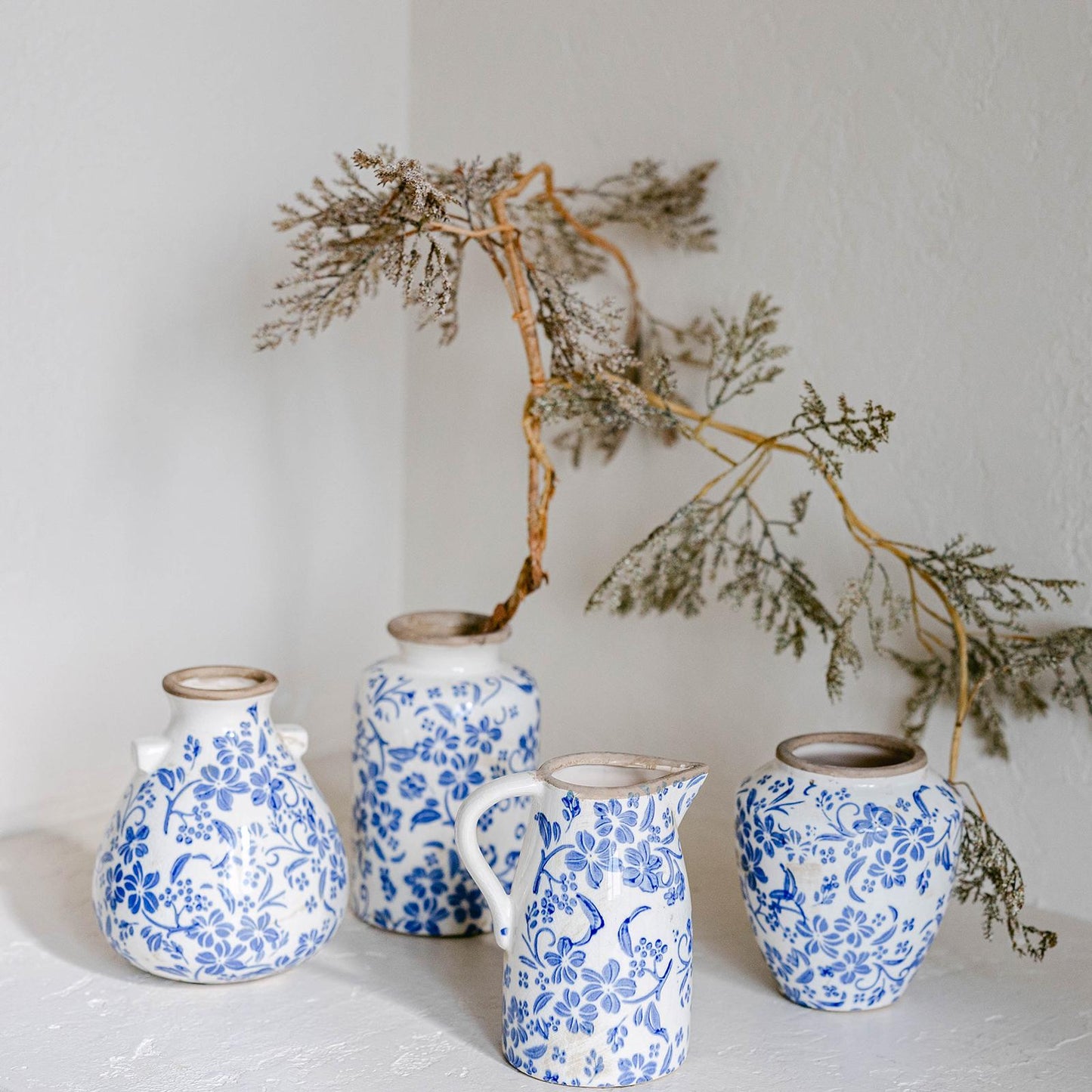 Blue Floral Pattern On White Rustic Vase