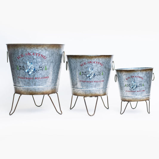 Set Of 3 Buckets On Metal Legs With Ice Skates And Text Planters