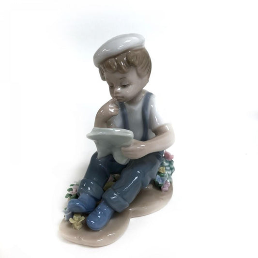 Boy Reading A Book Figurine