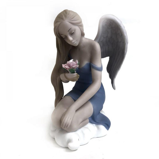 Kneeling Fairy Holding A Flower Figurine