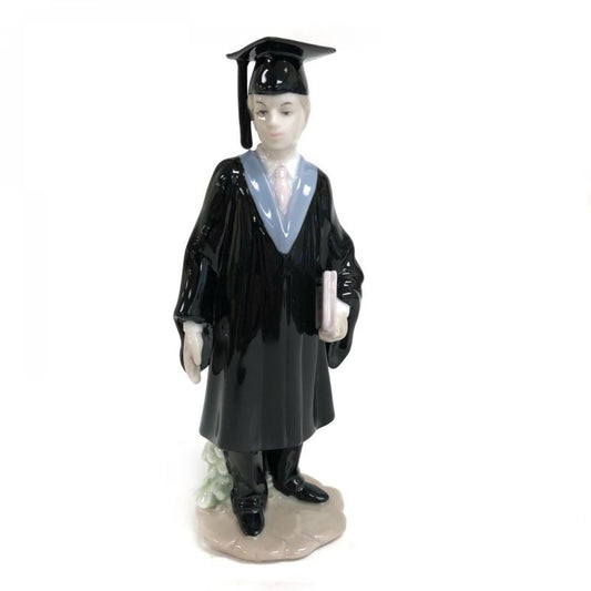 Male Graduate Holding A Book Figurine