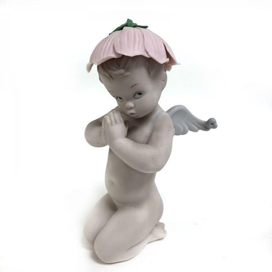 Kneeling Cherub Girl Wearing A Pink Leaf Hat Figurine