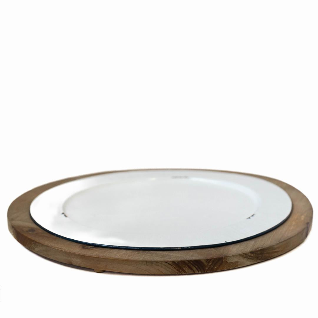 White Metal Plate In A Round Brown Built In Tray